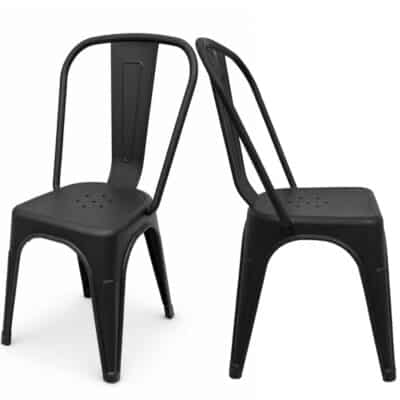 Two black metal chairs with curved backs and perforated seats, placed against a white background.|  Krzesło kawiarniane industrialne Metro PP – czarne | krzeslaonline.pl