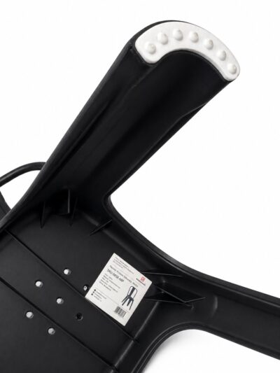 Black handheld device with a curved arm and a white, knobby head viewed from below; small product label visible on the base.|  Krzesło kawiarniane industrialne Metro PP – czarne | krzeslaonline.pl