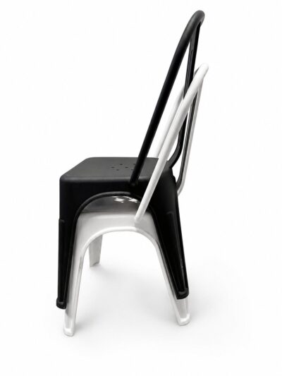 Side view of two plastic chairs stacked: a black chair on top of a white chair.|  Krzesło kawiarniane industrialne Metro PP – białe | krzeslaonline.pl
